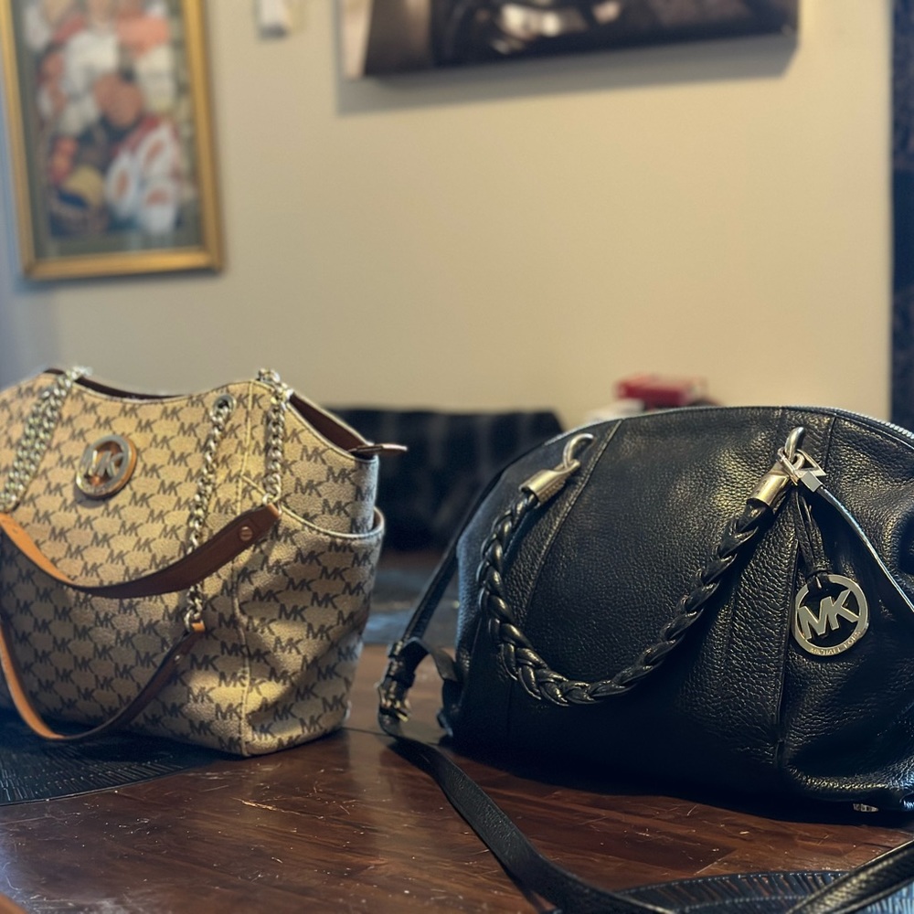 Two Michael kors bags one gold and one black leather